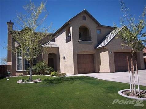 Lovely fron and backyard landscaping make this a home you will love to share with family and friends.