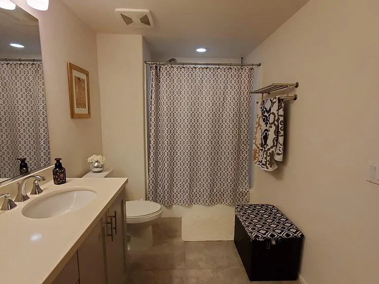 Spacious master bedroom bathroom with dual counter sinks