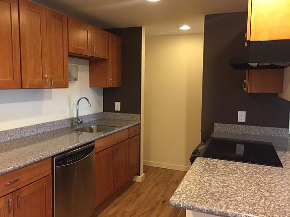 Kitchen w hard wood cabinets. AND stainless appliances