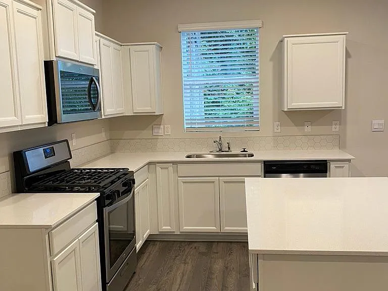 Kitchen features stainless steel appliances