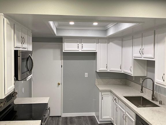 Kitchen door leads to attached garage.