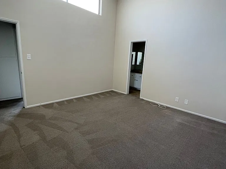 Bedroom with vaulted ceiling