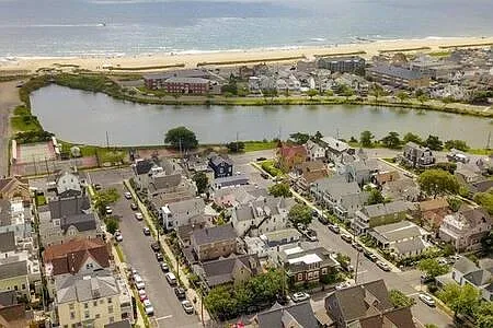 Yellow house in lower left corner. One block from tennis court, playground, and lake. Beach entrance where lake meets ocean.