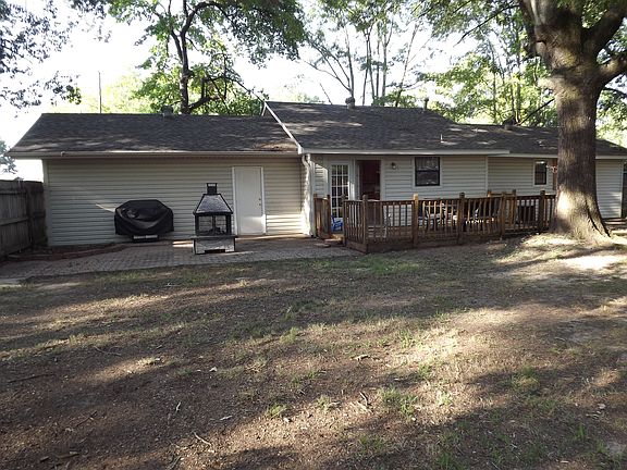 Backyard showing deck and grilling patio