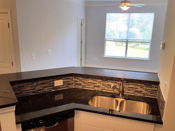From the kitchen, looking into the den. Laundry room is the door on the far left.