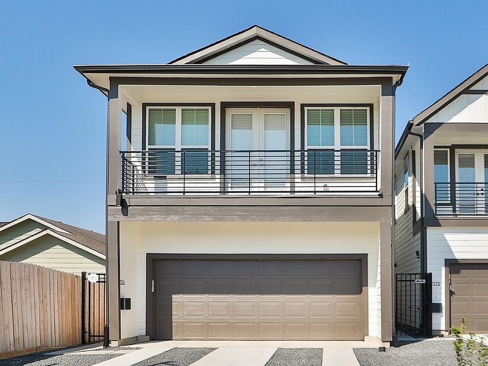 Enjoy sleek geometric lines and a spacious garage in this modern Independence Heights home in Housto