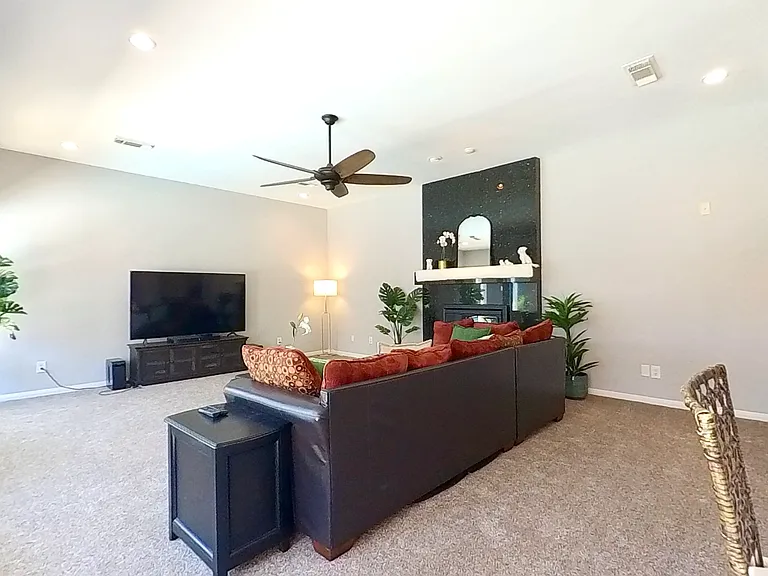 Living Room with a Dark Granite Fireplace
