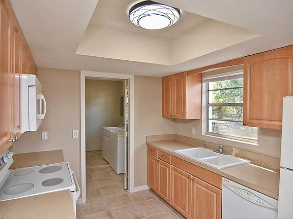 Kitchen with maple, wood cabinets.