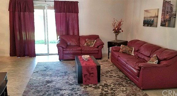 Spacious living room with door to rear patio