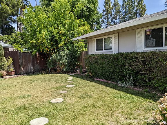 Walking path to backyard through side gate