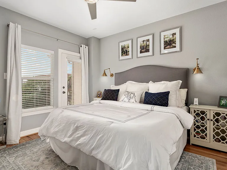 Mater bedroom with access to balcony and roof top deck