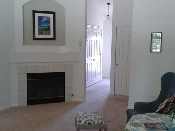 Living room includes gas fireplace and vaulted ceilings