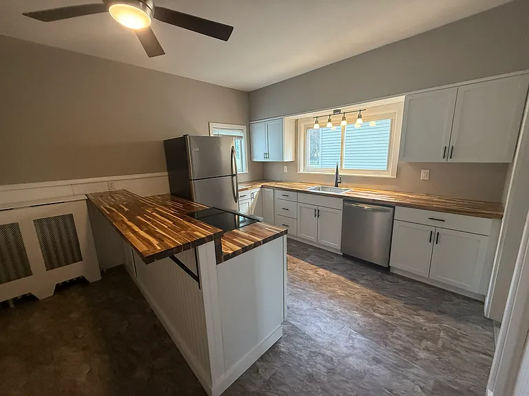 Beautiful Kitchen renovation with stainless steel appliances, new cabinets and butcher block countertops. Spacious for entertaining!