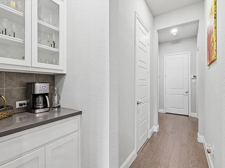 A dedicated built-in coffee bar and beverage station, perfectly positioned to streamline your morning routine or serve as a convenient hosting station for guests