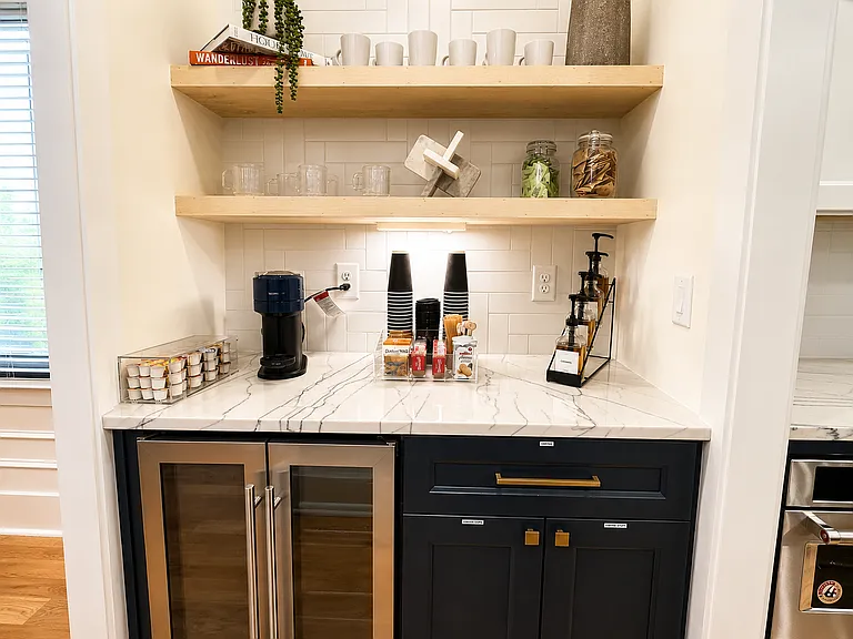 Fully stocked kitchen with quality dishes, glasses, pots and pans, baking sheets, mixing bowls, small appliances, utensils, wine glasses, kids dishes and everything you can think of!