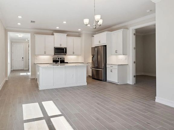 Kitchen and entrance to 3rd bedroom/great room