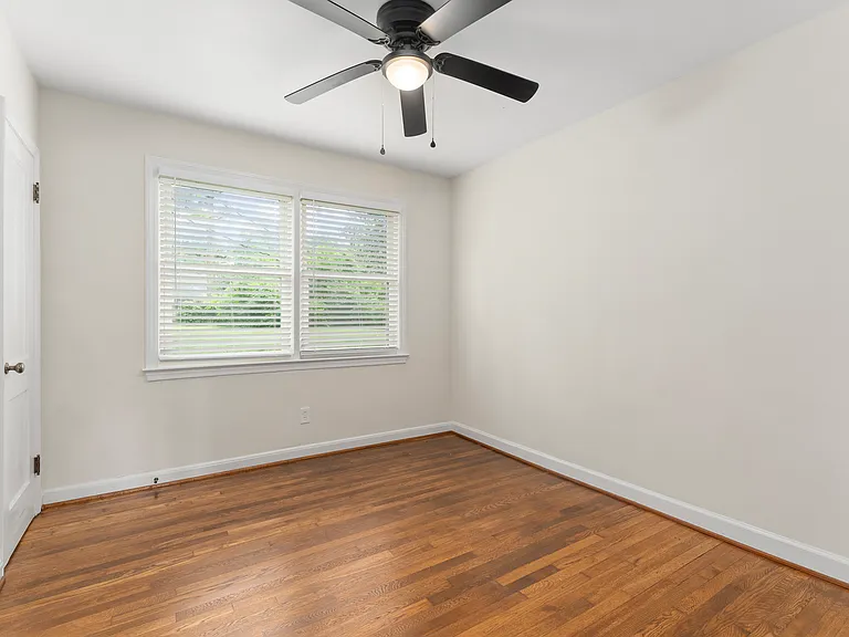 Newly refinished hardwoods throughout the home are beautiful and give the classic charm of a 1950's home to make decorating easy. This is the third bedroom which would also make a great home office if needed.