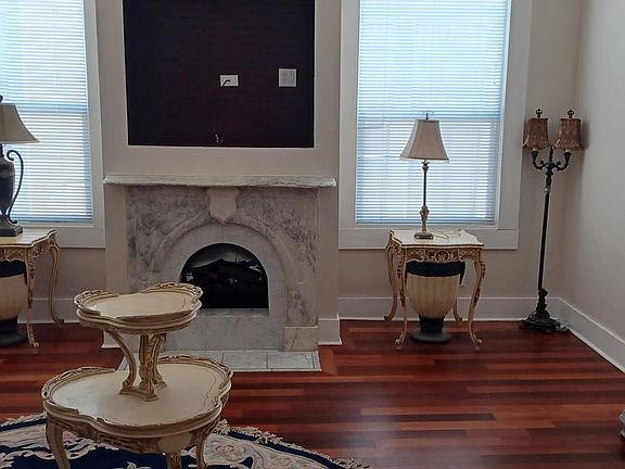 ANOTHER VIEW OF LIVING ROOM DECORATIVE FIREPLACE IN THE BACKGROUND, 12 FOOT CEILINGS, EXQUISITE FURNISHINGS