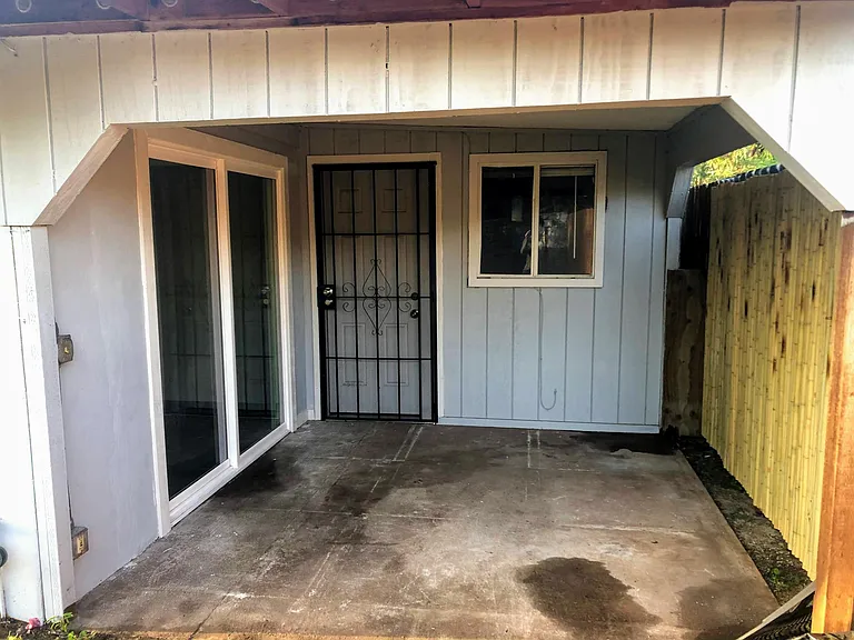Lanai for relaxation. Single door shown leads to bonus room (e.g. storage, home office, etc.) and laundry room.