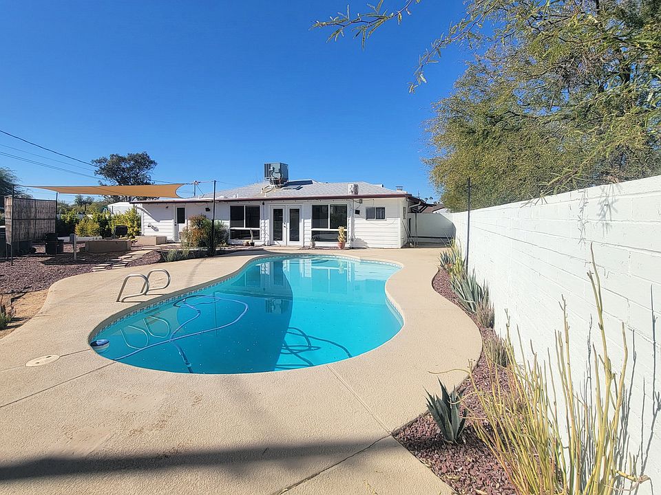 Pool with desert landscape. Landlord covers pool maintenance.