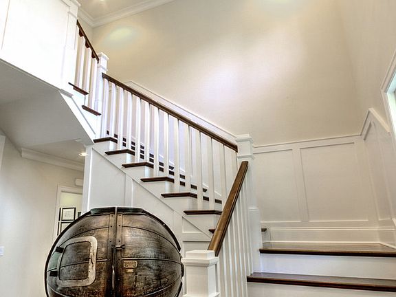 Foyer with gorgeous wood flooring and New Restoration Hardware Chandelier.