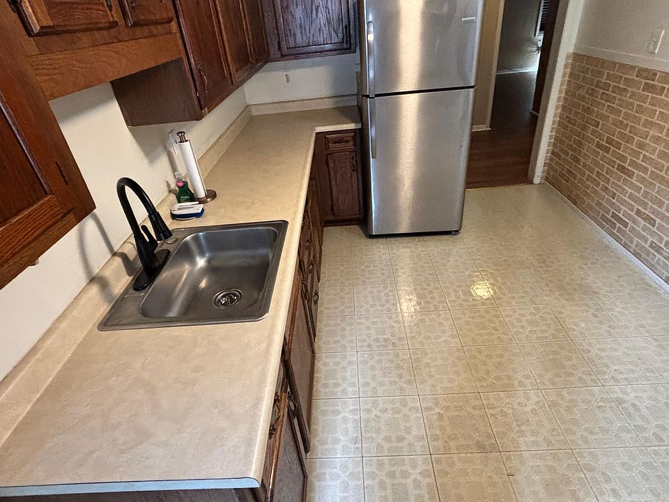 Large eat-in kitchen with stove and refrigerator