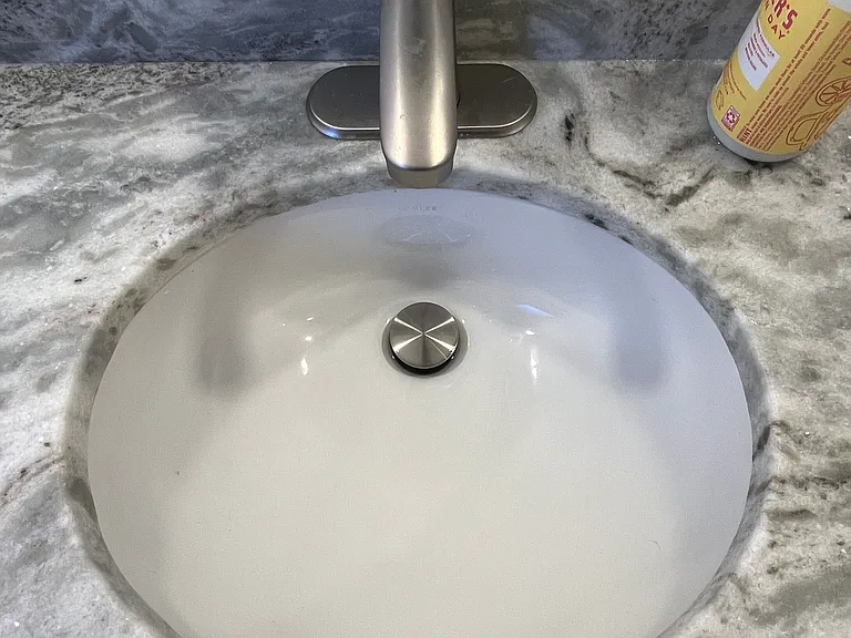 Gorgeous granite counters, w/ very sweet undermount porcelyn sink, w/ fawcett.