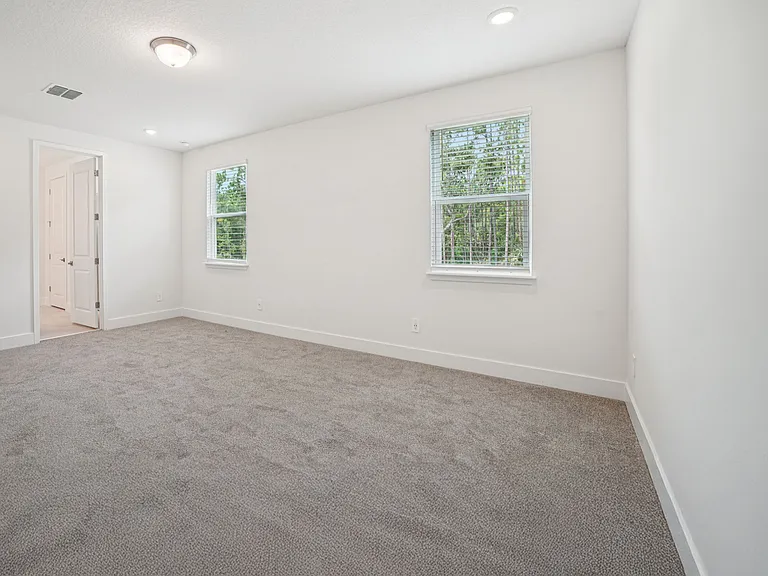 Master bedroom with views of the woods