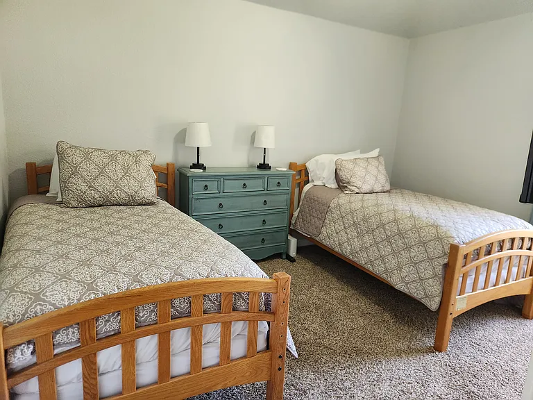 2 Twin Beds, dresser, large TV for gaming or movies, closet