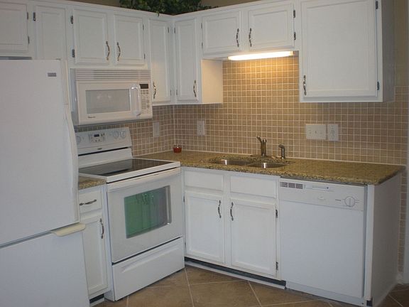 new kitchen w/ granite, 16x16 ceramic tile, tile backsplash, New appliances