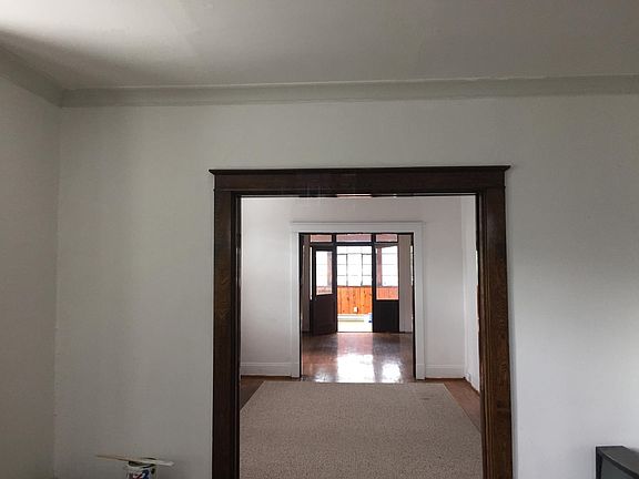 View of den and living room from dining room.