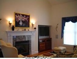 Formal living room w/vaulted ceiling and gas fireplace