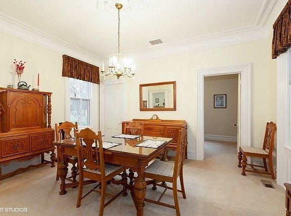 Large dining room just off main entry is adjacent to Kitchen, living room and main floor bedroom.