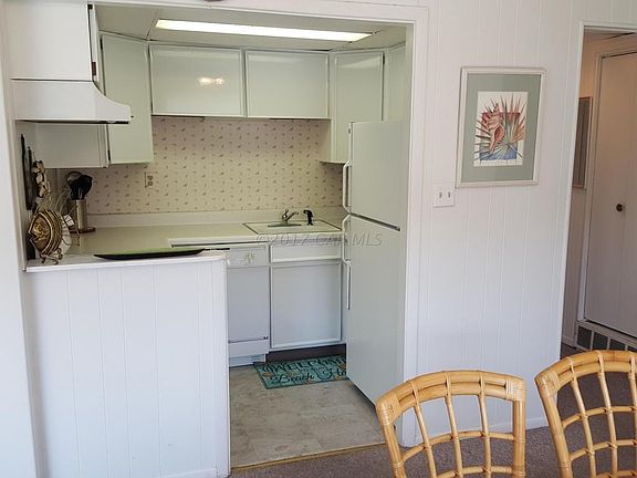 Kitchen with wall cut out