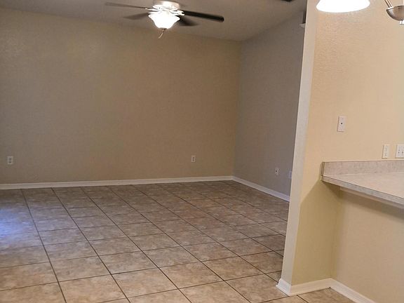 Dining room view of living room and bar to kitchen