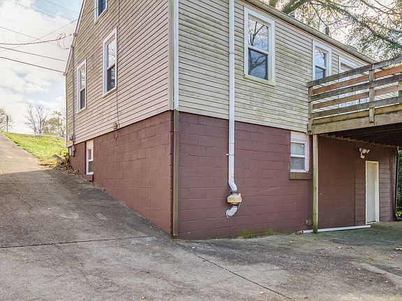 Large driveway with parking under the deck as well
