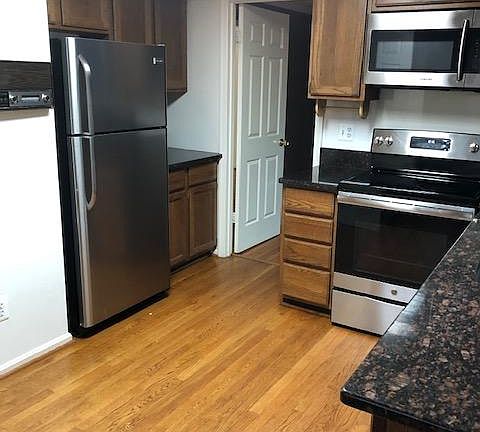kitchen granite and SS hardwood