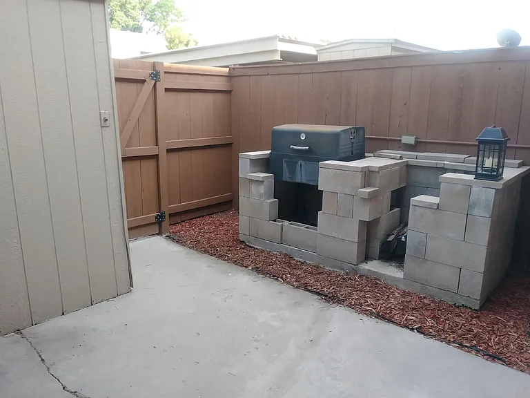 Large Smoker and 2nd Enclosure For Gas Grill On Patio