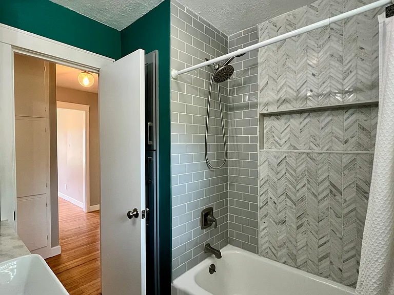 Bathroom
Features: Marble mosaic on the floor and shower.