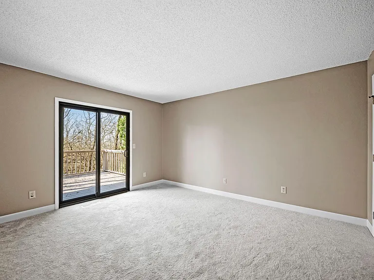 Bedroom 2 with walk out to deck