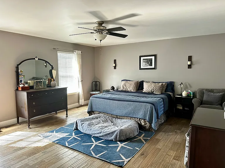 Primary suite with oak hardwood floors.