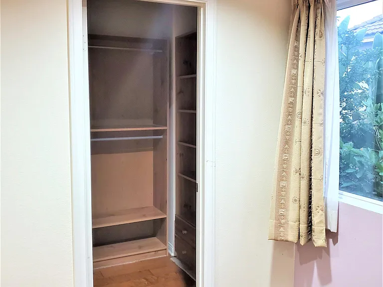 Walk in Closet for Bedroom #4 (1st floor). All walls are now painted a neutral (barely yellow) color.
