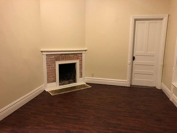 Dining room with decorative fire place with new flooring