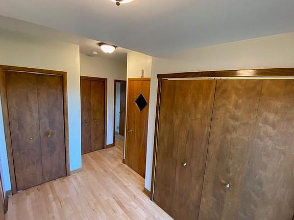 Entry with three spacious closets for storage