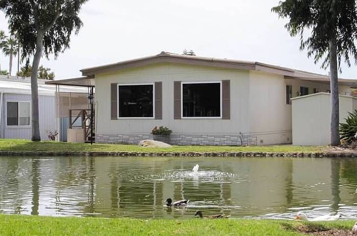 House is steps from lake.