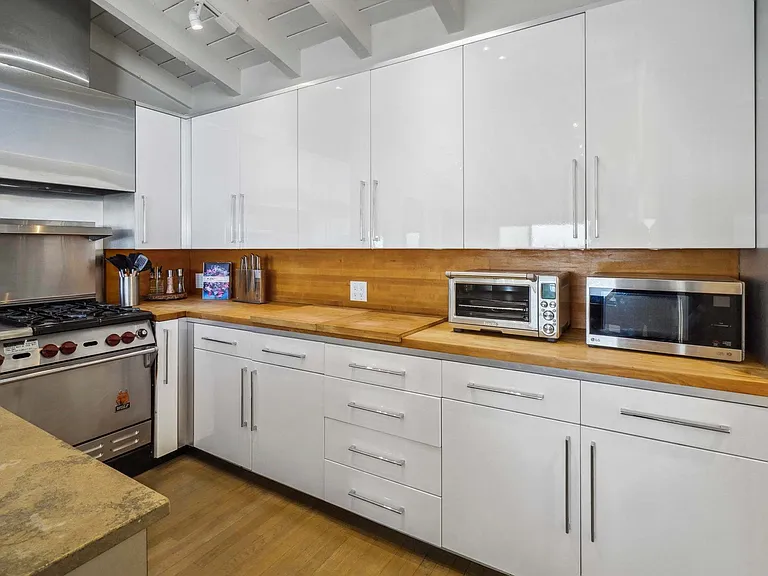 Custom cabinets and ample counter space for easy organization and preparation.