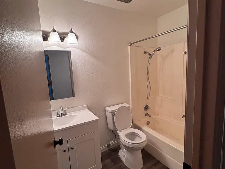 Common Bathroom with brand new vanity and toilet