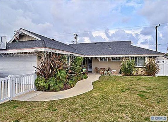 Fenced front yard on the corner of two streets