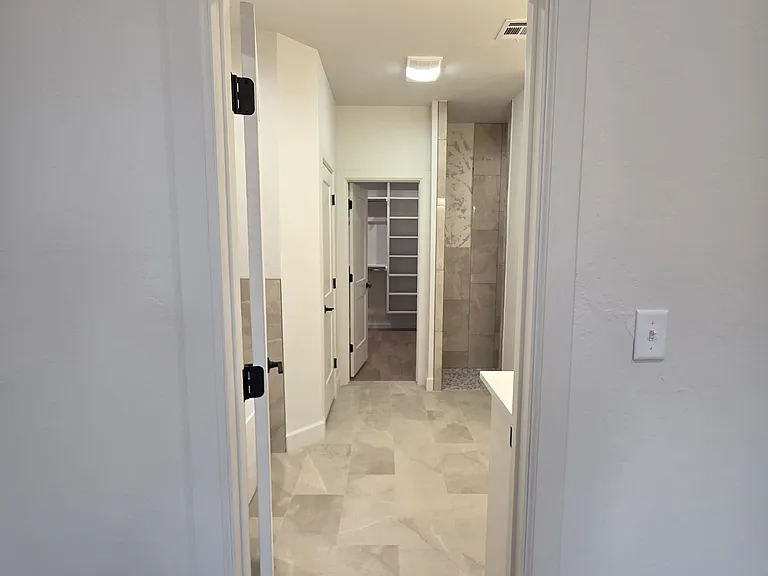 The huge master walk-in closet is off the master bathroom