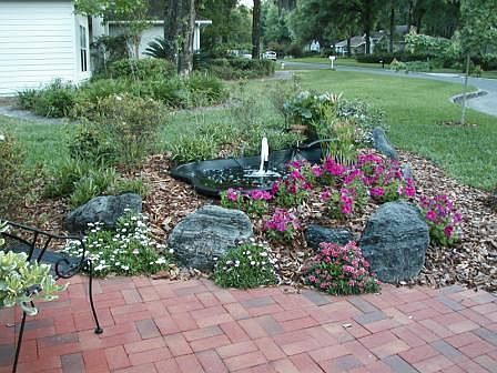 Brick patio and pond with fountain
